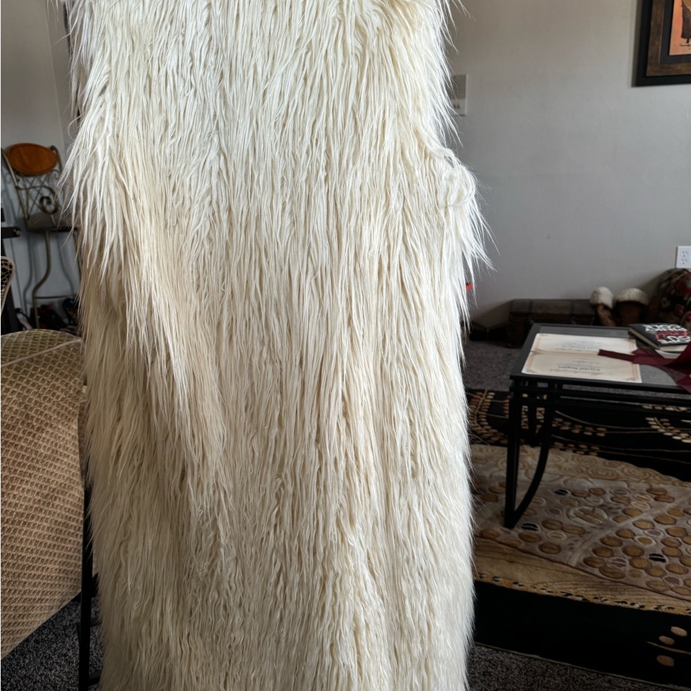 Cream shaggy faux fur vest. Only worn a few times. Can be dressed up or down.